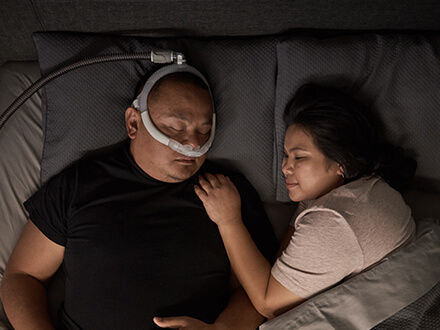 Patient-wearing-ResMed-AirFit-P30i-nasal-pillows-freedom-mask-2022